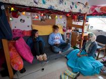 Students sitting in their dorm room hanging out