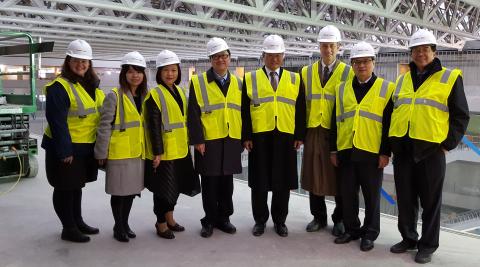 A delegation from the Taipei Medical University tours the construction site of CWRU's Health Education Campus.