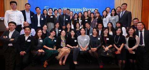 A group of Chinese alumni pose together at an event in Shanghai, China.