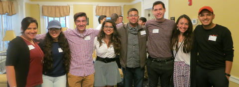 Photo of CWRU students, standing arm in arm, posed and smiling for the camera at the 2017 Latino Alumni Network and La Alianza Student Networking event