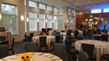 A photo of the Foster-Castele Great Hall at the Linsalata Alumni Center, full of tables set for a wedding reception
