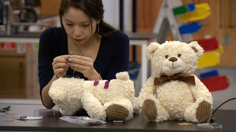 a student wiring a teddy bear with a microchip