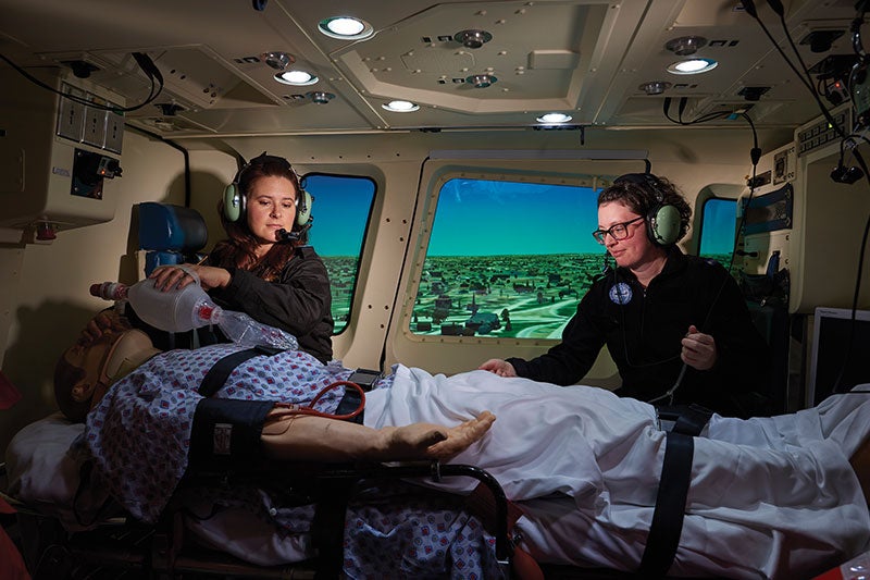 Photo of nursing students in the new flight simulator