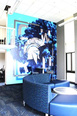 Clarke Tower Lounge with CWRU Mural and surrounding furniture