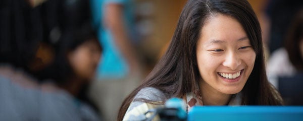 Students walking across a snowy campus