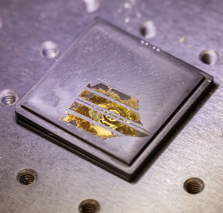Closeup of a microchip on a metal surface