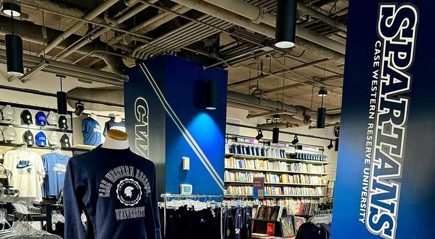 An inside view of Case Western Reserve University's bookstore with a mannequin, rows of merchandise and signage that reads Spartans.