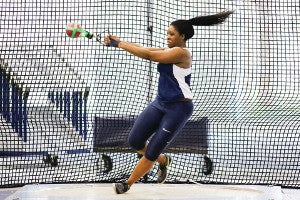 A photo of CWRU student Temi Omilabu in the middle of a track and field throw