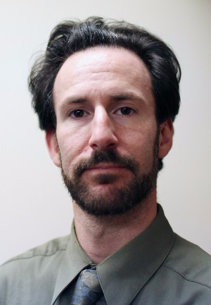 A headshot of Associate Professor Justin Buchler