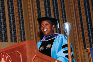 A photo of Stephanie Tubbs Jones in graduation garb at a podium