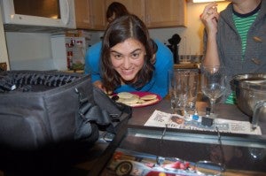 Student smiling over pancakes