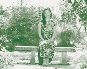 Headshot of Grace Zhang standing in a garden