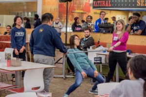 Students participating in limbo competition at Late Night Breakfast