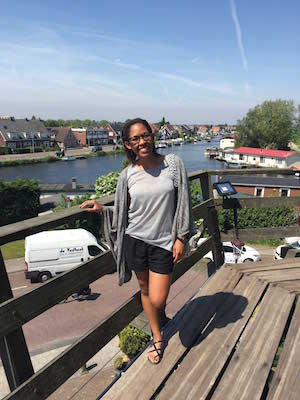 Case Western Reserve University student Fayla Junior in Amsterdam with river in the background.