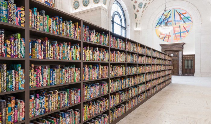 Yinka Shonibare's The American Library, a long bookshelf with countless colorfully decorated books.