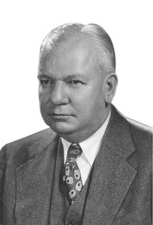 Black and white headshot of Claude Beck