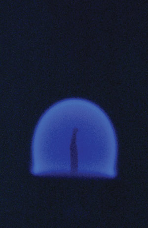 A close up of a blue flame.
