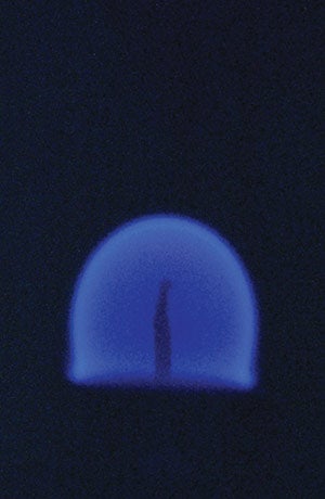 A close up of a blue flame.