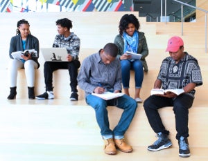 Five students busy studying in Tinkham Veale