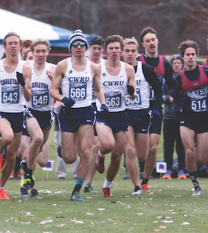 Case Western Reserve men's cross-country runners coming off the start line during a race