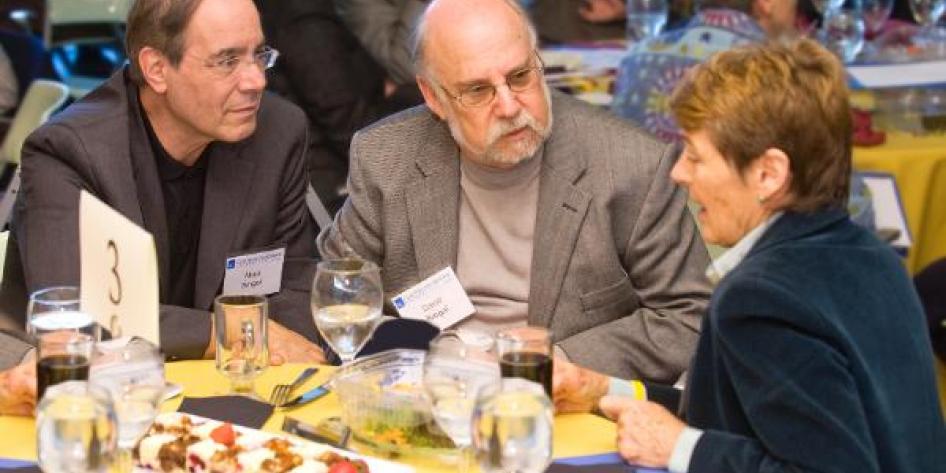 Three Case Western Reserve University leaders conversing at 2010 Provost Retreat