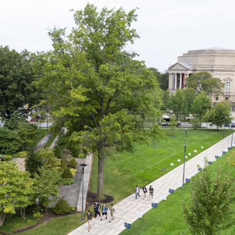 Aerial view of the binary walkway with green space on either side, Severance Music Center in the distance