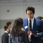 Students dressed professionally at career fair 