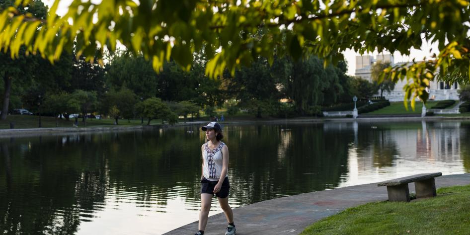 Student walks around Wade Lagoon