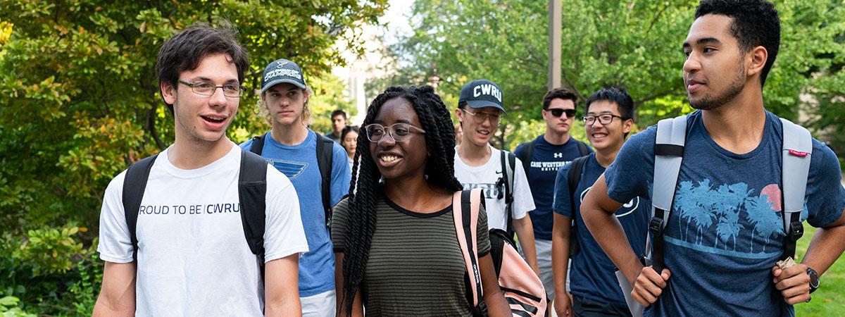 Groups of students walk across campus at Case Western Reserve University
