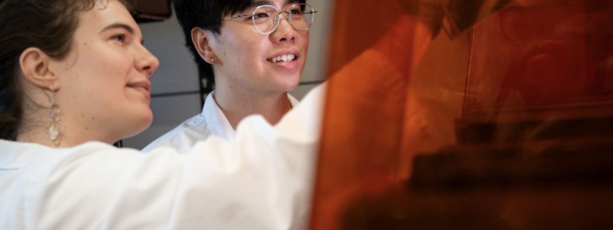 Students in a lab smiling