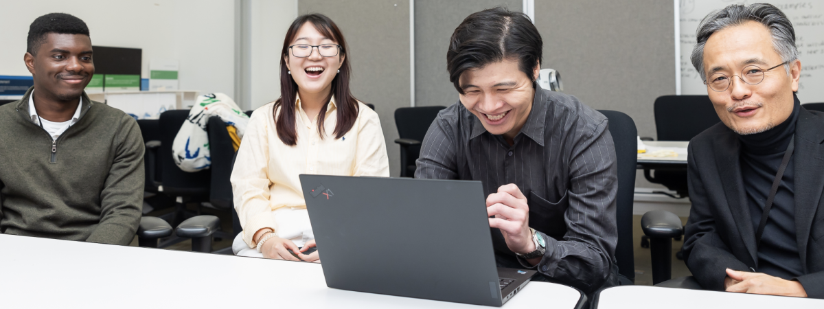 Students studying with professor