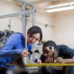 2 students working together in an engineering lab 