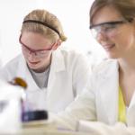 2 female students working on a lab in the Macro Chemistry Lab