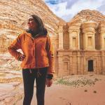 Study Abroad image of a student posing in front of a structure in the desert
