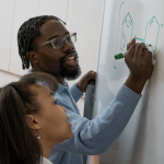 Student writing on a whiteboard