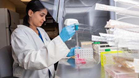 Woman doing something in a lab