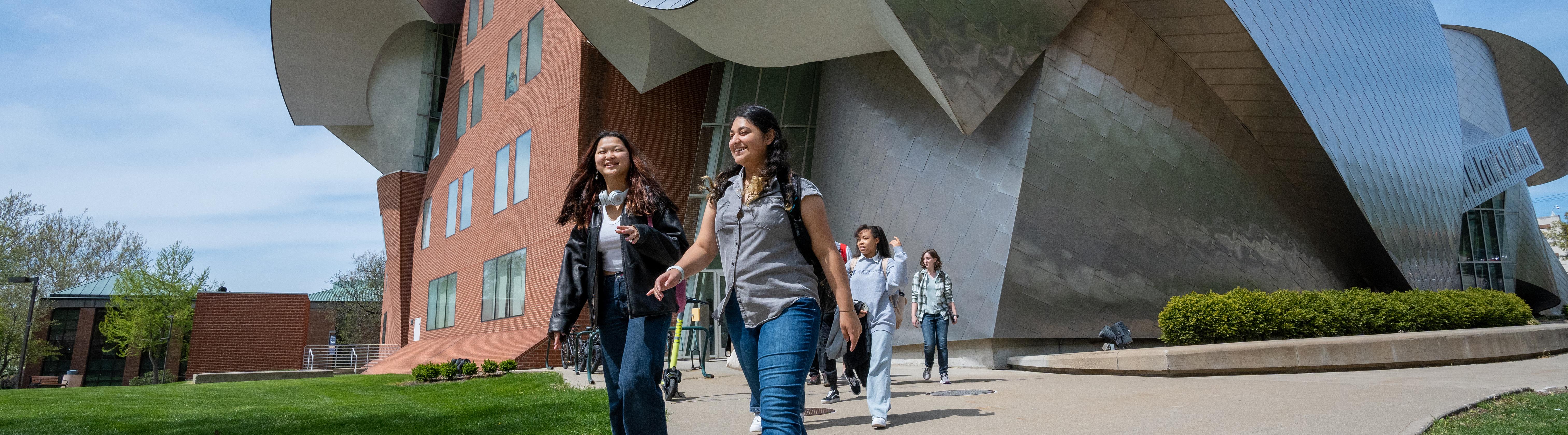 A group of students walking out of the Peter B. Lewis building