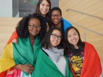 Case African Student Association posing for a photo with their countries flags