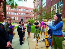 Case Western Reserve students take a surveying class outside in the campus quad