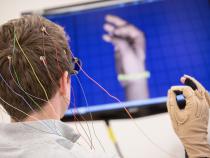 Student conducts research with hand sensors