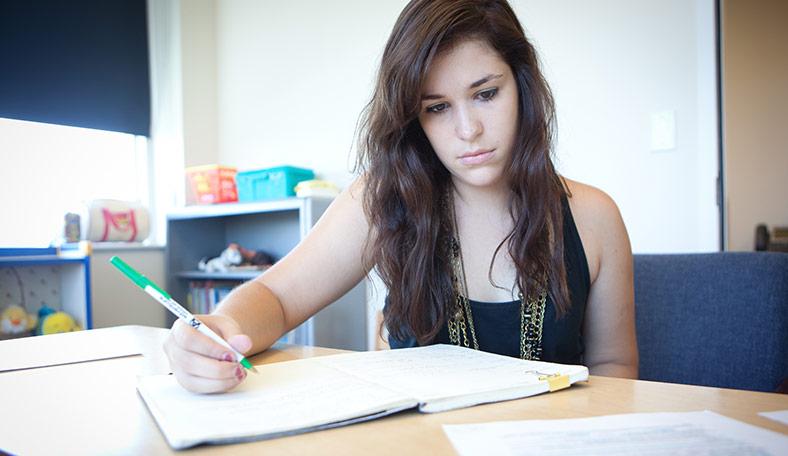 Student working on a report during an internship