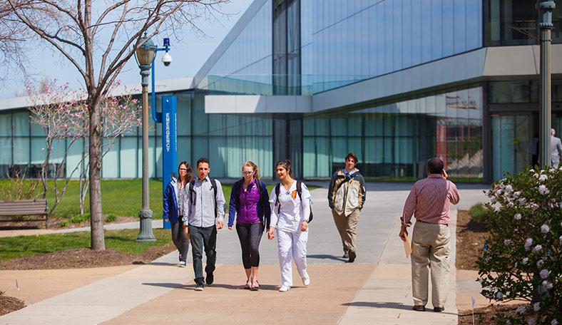 students walking outside of the Tink