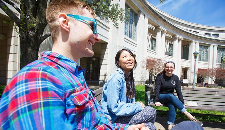 Students sitting outside of the Kelvin Smith Library