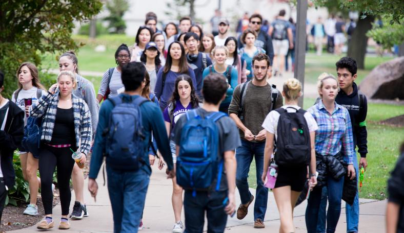 students walking across campus
