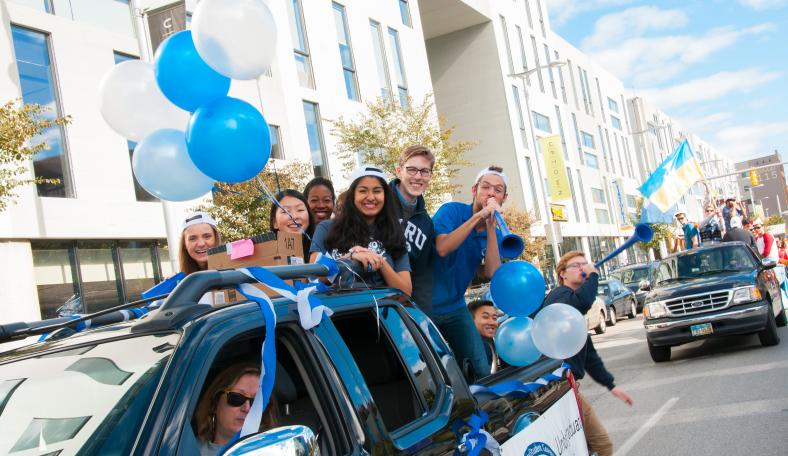 Case Western Reserve University students on parade float during homecoming parade