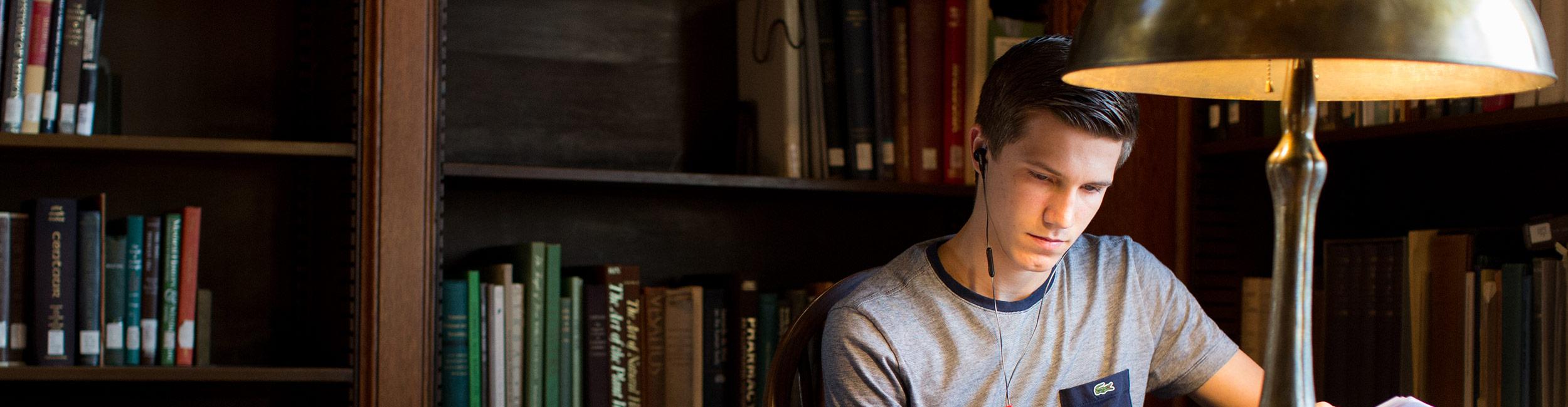 CWRU student studying in the library