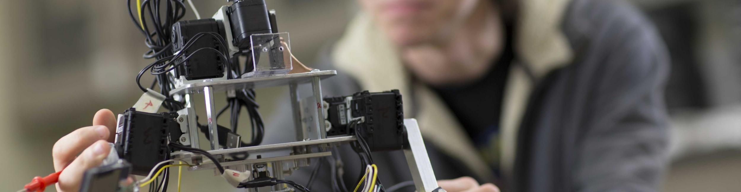 CWRU student with engineering robot