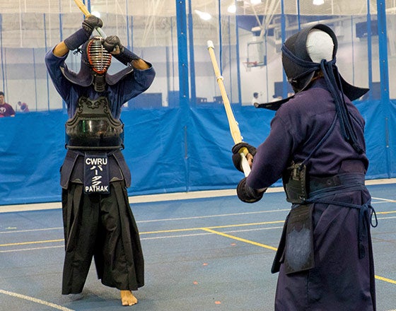 Fencing team practicing on campus