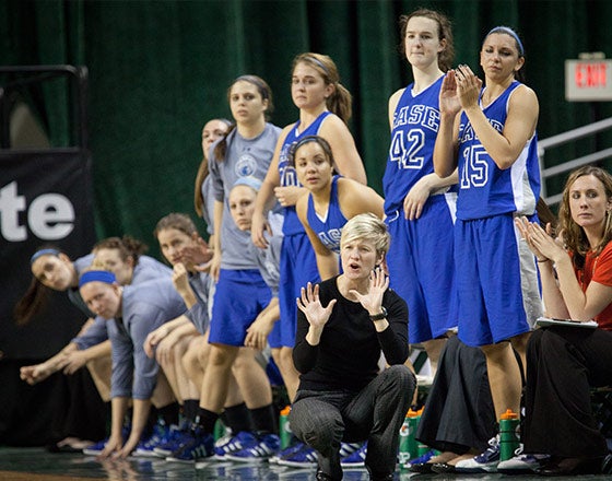 CWRU women's basketball team on the sidelines during a game