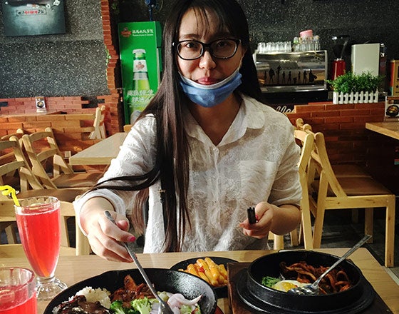 Student eating local cuisine while abroad